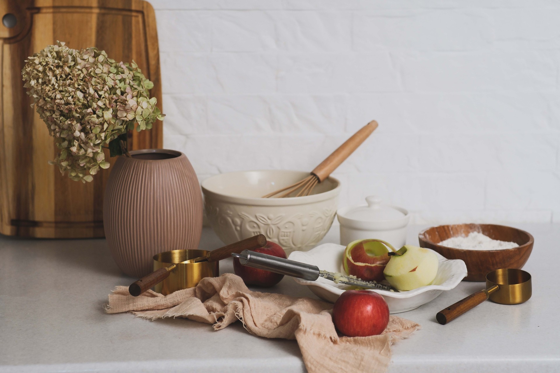 A Rustic Kitchen Scene Featuring Fresh Ingredients and Varied Kitchenware for Cooking